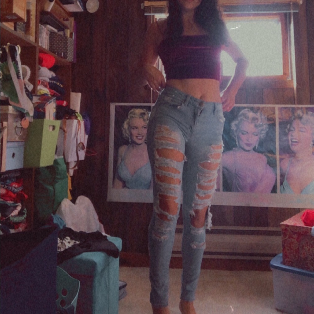 Destroyed American Eagle blue jeans